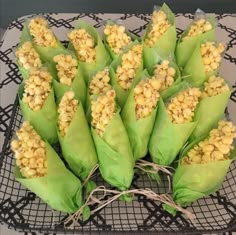 corn on the cob wrapped in green paper