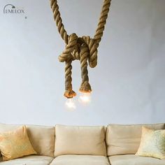 a rope light hanging from the ceiling over a couch