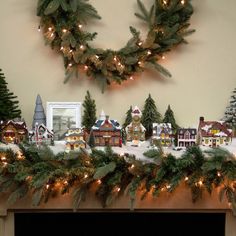 a fireplace mantel decorated with christmas decorations