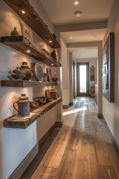 a long hallway with wooden shelves filled with pots and pans