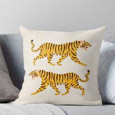 two tigers walking across a white background throw pillow