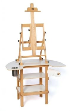 a wooden easel with a painting stand and paint rollers on the bottom shelf