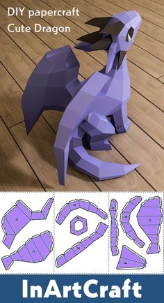 papercraft cut out dragon sitting on the floor with instructions for how to make it