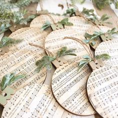 several pieces of music are arranged on top of each other with leaves and sheet music