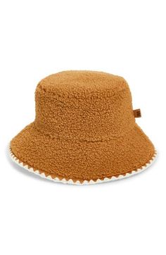 Top off your cold-weather looks with the signature UGG coziness of this fluffy faux-fur bucket hat finished with scalloped stitching. Lined 100% polyester Hand wash, dry flat Imported Fur Bucket, Faux Fur Bucket Hat, Fur Bucket Hat, Fleece Hats, Elegant Hats, Pink Accessories, Scallop Trim, Women's Headwear, Leather Label