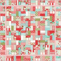 a red and green patchwork quilt with many different patterns on it's sides