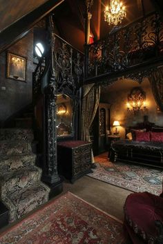 a very fancy looking room with stairs and chandelier