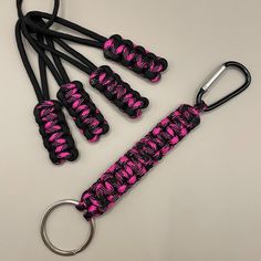 This Is A Brand New, Handmade Paracord Keychain 7” In Length. Made With Pink And Black 550 Paracord. It Has A Silver Colored Key Ring On One End And A Black Carabiner Clip On The Other End. It Also Includes 4 Matching Zipper Pulls That Can Be Used On The Zippers Of A Jeep, Bronco Or Any Soft Top And/Or Doors To Make Their Use Much Easier. You Can Also Put Them On Backpacks Or Whatever Else You'd Like! Paracord Keychain, Carabiner Clip, Monkey Business, 550 Paracord, Zipper Pulls, Soft Tops, Pink And Black, Paracord, Business Design