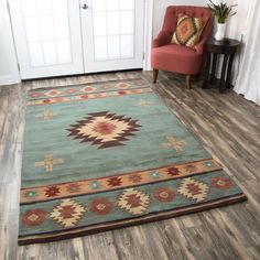 a living room with a chair and rug on the floor