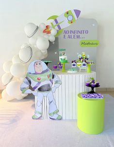 a spaceman themed birthday party with balloons and decorations