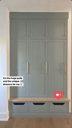 an empty room with some gray cabinets and wooden flooring on the walls, one has a message that reads it's the huge puffs and the unique