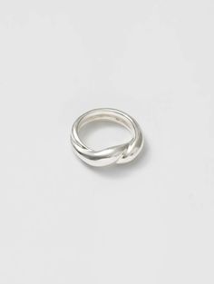 Beyond basic. • 925 Sterling silver twist ring • Band measures 7mm at widest point • Made with recycled metals • Available in size 5-9 Minimalist Silver Twisted Ring, Minimalist Twisted Silver Ring, Sterling Silver Twisted Rings With Modern Style, Modern Twisted Sterling Silver Rings, Modern Twist Sterling Silver Twisted Ring, Twisted Sterling Silver Rings, Twist Ring Band, Twisted Band Ring, Twist Ring