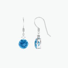 Product Details These elegant drop earrings feature stunning round shape swiss blue topaz stone, and shimmering Moissanite set in prong setting. The earrings are crafted in luxurious gold and hang from delicate fish hook backs, adding a touch of sophistication to any outfit. The beautiful blue topaz stone are offset by the glittering Moissanite, creating a mesmerizing and eye-catching look. These classic earrings are the perfect accessory for adding a pop of color and sparkle to any outfit, maki