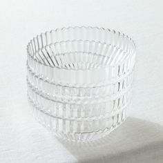 three clear glass bowls sitting on top of a table