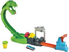 there is a toy train set with a green dragon on the track and cars around it