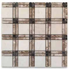 a white and brown tile wall with squares