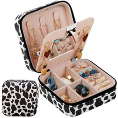 a black and white suitcase with jewelry in it