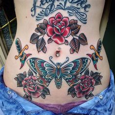 a woman's stomach with tattoos and flowers on the side, including a butterfly