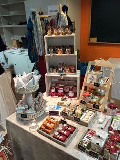 a table topped with lots of different types of treats and candies on top of it