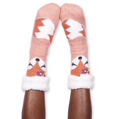 These sweet, cozy slipper socks are like a great, big hug. A fluffy and plush inner lining provides cozy warmth, while the pillow-soft knit outer cradles your feet in cushiony comfort. A marshmallow-light foam bottom makes every step feel like you're walking on a cloud, while our special Safety Dots® non-slip grippers help keep you from taking flight. Like all Fuzzy Babba slipper socks with grippers, this style is machine washable and best enjoyed indoors. Part of the Cozy Warmer® family. Plush One Size Cozy Soft Knit Socks, Winter Slippers With Faux Fur Lining For Loungewear, Winter Faux Fur Lined Slippers For Loungewear, Winter Loungewear Slippers With Faux Fur Lining, Warm Cozy One Size Socks, Cozy Warm One Size Socks, Warm Cozy One-size Socks, Cozy Warm One-size Socks, Soft Indoor Socks For Winter