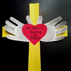 a handprinted heart on top of a cross with the words my heart is burning for jesus