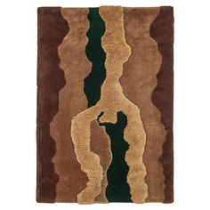 a brown and green rug with an abstract design