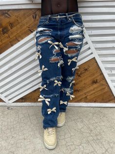 Stand out and celebrate your school pride with our custom hand-painted jeans! Designed for students, graduates, fans, family, teachers, and staff, each pair is a one-of-a-kind creation tailored to your unique vision. Whether you want your school's logo, mascot, favorite sport, club, or even graduation year, we bring your ideas to life with vibrant, hand-painted artwork. These school-themed jeans are perfect for spirit days, games, or simply showing off your dedication in style. *Note: Customer provides the pants. Once your is placed, you will receive confirmation message providing our address. Senior Week Jeans, Senior Week Pants, Cheer Spirit Jeans, Painted Jeans School Spirit Football, Painted Game Day Jeans, School Spirit Jeans, Edited Bow Jeans, Bow Jeans, Spirit Days