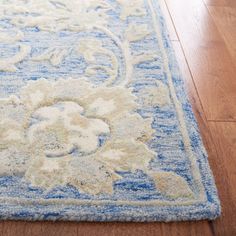 a blue and white rug on the floor