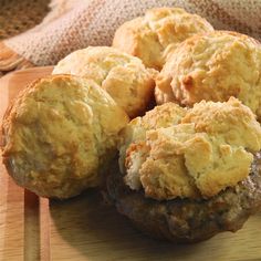 some biscuits sitting on top of a wooden cutting board