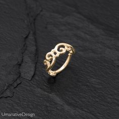 Beautiful gold nose ring. Tribal and delicate design, can be worn as a nose ring, earring for the tragus, helix, earlobes & as a septum ring as well. Material: 14k Gold plated on Sterling silver base Wire Thickness: 0.8 mm - 20g Inner Diameter Of The Ring: 7mm - 0.27Inc *Nickel-free For other nose rings- We offer a range of septum rings, for pierced and non- pierced noses, made of different materials. You can find fake septum rings at this link- https://www.etsy.com/shop/Umanativedesign?sect Adjustable Gold Elegant Septum Ring, Elegant Adjustable Gold Septum Ring, Elegant 14k Gold Hypoallergenic Septum Ring, Wedding Hoop Septum Ring, Adjustable Elegant Hoop Nose Ring, Elegant Adjustable Hoop Nose Rings, Nickel Free Hoop Septum Ring For Wedding, Elegant Adjustable Hoop Septum Ring, Nickel-free Hoop Septum Ring For Wedding