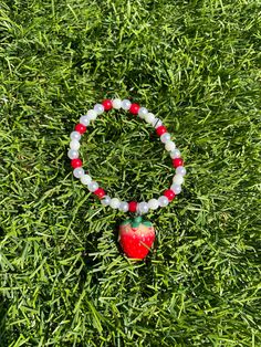 This beautiful bracelet the most lovely gift for strawberry lovers! The bracelet is featured on elastic and crimped. One size fits most. Please contact me for any sizing inquiries so that I can best accommodate you. Cute Red Stretch Bracelet As Gift, Cute Red Stretch Bracelet Gift, Casual Red Charm Bracelet Gift, Strawberry Clay Bracelet, Bracelet Patterns Strawberry, Strawberry Jewelry Diy, Beaded Strawberry Bracelet, Fruit Bracelet Strawberry Clay Beads, Strawberry Bracelet