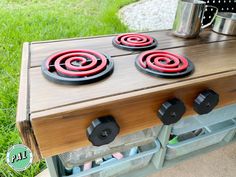 an outdoor stove with three burners on it