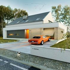 an orange car is parked in front of a house with a dog standing next to it