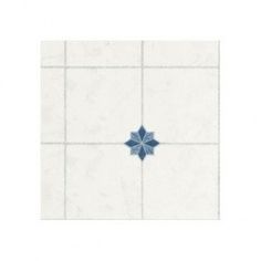 a white and blue tile wall with a flower on it