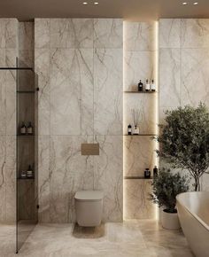 a modern bathroom with marble walls and flooring