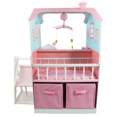 a doll house with pink furniture and accessories