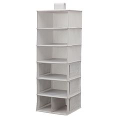 an empty white shelf with several compartments