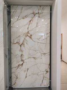 a large white marble shower in a bathroom