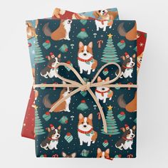 three wrapping paper with dogs and christmas trees on them, tied together in brown twine