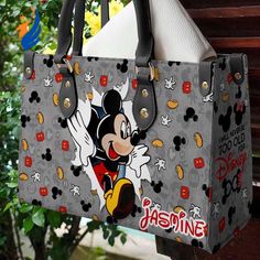 Mickey Mouse Disney Handbag Fashion Lady Handbag is a magical accessory that combines style and nostalgia. Made from premium materials, this handbag features a vibrant Mickey Mouse design that adds a touch of fun to any outfit. With its spacious interior and multiple pockets, it offers ample storage for your essentials. The adjustable strap allows for comfortable carrying options, while the sturdy construction ensures durability. Perfect for Disney enthusiasts, this handbag is a timeless piece t Mickey Mouse Bag, Mickey Mouse Design, Disney Purse, Magical Accessories, Disney Handbags, Disney Hoodies, Never Too Old, Leather Handbags Women, Fashion Lady