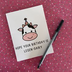 a birthday card with a cartoon cow wearing a party hat