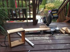 a circular saw sits on top of a wooden bench