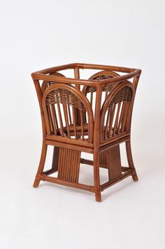 a small wooden table with two chairs on it's legs and one chair in the middle