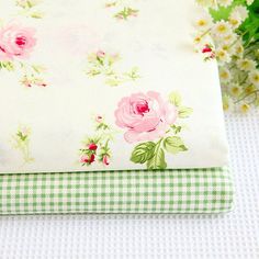 two pieces of fabric with pink flowers on green and white gingham checkered