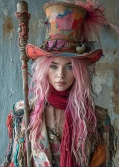 a woman with pink hair wearing a hat and holding a stick