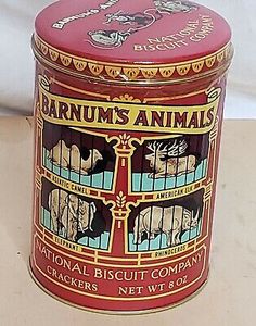 an old tin can with animals painted on the front and sides, sitting on a table