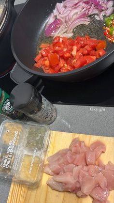 the ingredients are being prepared to cook on the stove top, including meat and vegetables