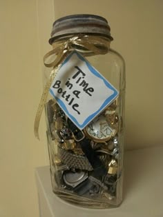 a glass jar filled with lots of different items