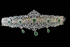 About the Jewellery Flaunt your waist with this peacock motif bridal waist belt Crafted by Highly Experience workman's Studded with brilliant round cut diamonds, emeralds Cz droplets hanging at regular intervals give the oddiyanam a delicate appearance Details & Specifications Metal-Brass, silver Finish-Diamond Polish-24 ct gold plated Stones-American Diamonds Beeds-Cz Hangings Size-Adult For-Woman Occasion-Birthday, party, wedding, Reception,angejment Diamond Vaddanam Designs Latest, White Stone Vaddanam, Chain Type Vaddanam Designs, Diamond Waist Belt Indian, Detachable Vaddanam, Closed Setting Diamond Vaddanam, Diamond Vaddanam, Peacock Motif, Tea Wedding Favors