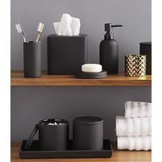 two shelves with soap, toothbrushes and other bathroom items on top of them